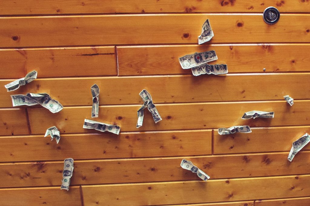 Dollar bills pinned to the ceiling reminiscent of northwoods restaurants