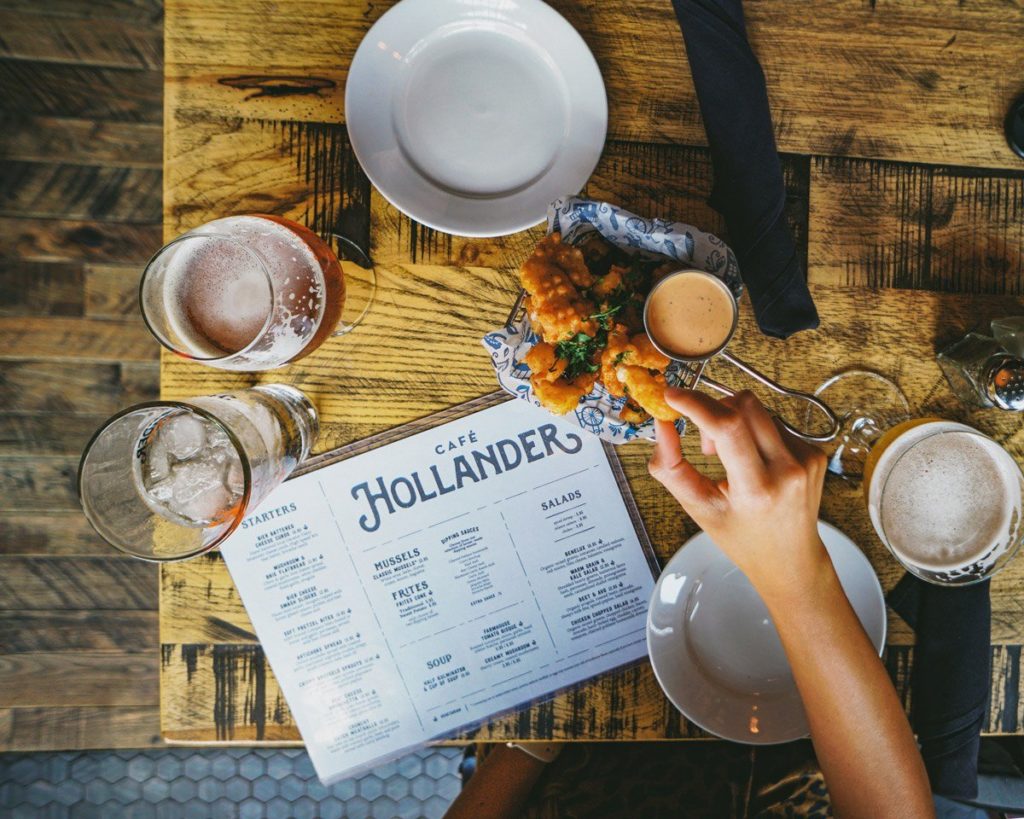 Aerial shot of Hollander's menu and a sharable dish