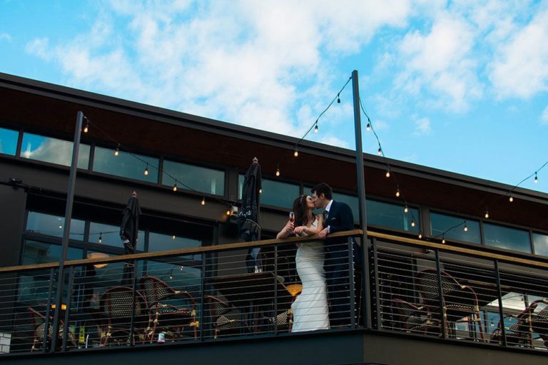 View of loft at Hollander in Mequon with couple on wedding day