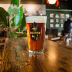 A pint glass of beer at Café Benelux