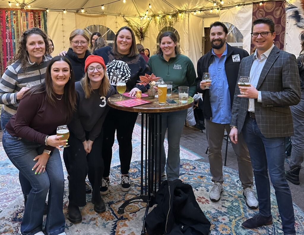 Group of friends smiling at Centraal Grand Cafe and Tappery